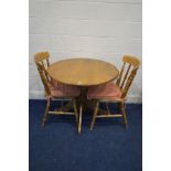 A MODERN BEECH CIRCULAR DROP LEAF KITCHEN PEDESTAL TABLE, and two chairs (3)