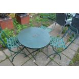 A GREEN PAINTED CIRCULAR ALUMINIUM TABLE with three matching chairs