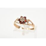 A 9CT GOLD CLUSTER RING, the tiered cluster set with a central single cut diamond with a circular