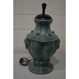 A GREEN GLAZED POTTERY STANDARD LAMP