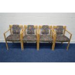 A SET OF FOUR ERCOL MODEL 775A BEECH FRAMED ARMCHAIRS, with floral upholstery (worn finish)