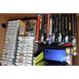 A NINTENDO DS WITH TWO PUZZLE GAMES and a quantity of empty DS game boxes together with twelve PC CD