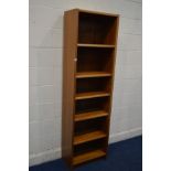 A TALL SLIM MID 20TH CENTURY TEAK BOOKCASE, stamped to reverse, 'up made in Denmark', width 57cm x