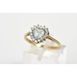 A 9CT GOLD TOPAZ CLUSTER RING, designed with a heart shaped blue topaz with a circular cut cubic