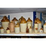 EIGHTEEN STONEWARE FLAGONS, JAR, BOTTLES AND HOT WATER BOTTLES, including several with printed