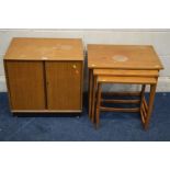 A MID 20TH CENTURY TEAK TWO DOOR RECORD CABINET together with a teak nest of three tables (sd to