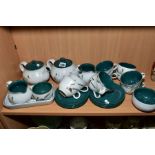 A DENBY GREEN WHEAT PATTERN TEA SET, comprising two tea pots, two milk jugs, four sugar bowls, eight