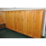 A RUN OF OAK DOORED LOCKER, comprising of sixteen with 134.5cm doors, twenty with 99.5cm high doors,