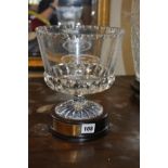 A CUT GLASS BOWL ON WOODEN PLINTH, etched Ford Golf and the base holds a plaque engraved Ford