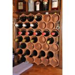 A MODULAR TERRACOTTA WINE RACK, with thirty five individual tubes (wine is NOT in this Lot)