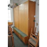 A RUN OF TEN OAK FACED LOCKERS, constructed two three tall door section above a shallow seat and two