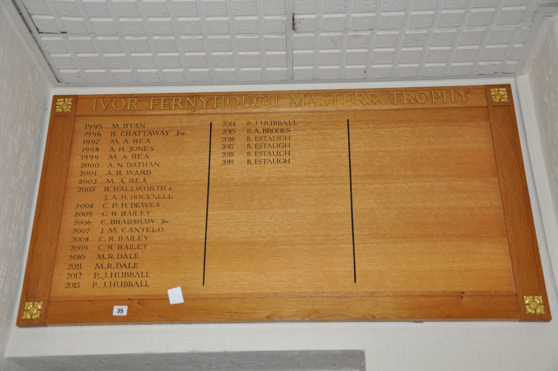 AN OAK FACED HONOURS BOARD, with gilt rose bosses to each corner, Ivor Fernyhough Masters Trophy
