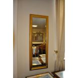 A PAIR OF MODERN GILT FRAMED WALL MIRRORS, with bevelled glass, 140cm x 50cm (2)