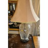 A CUT GLASS BALUSTERED TABLE LAMP WITH SHADE, 20cm in diameter and 78cm to top of shade