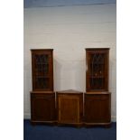 A PAIR OF YEWWOOD SINGLE DOOR CORNER CUPBOARD'S, together with a low corner cupboard with a red