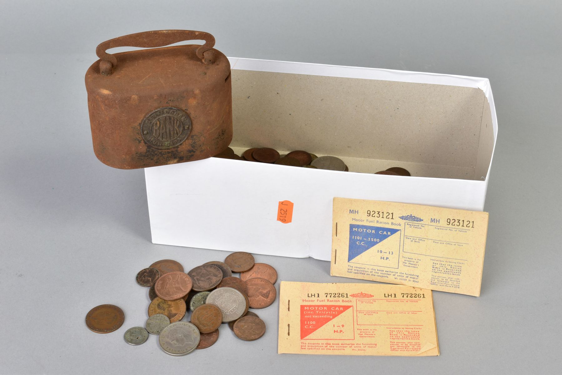 A SHOE BOX OF MIXED COINS with a Birmingham municipal money bank