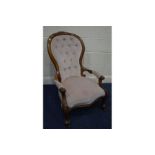 A VICTORIAN WALNUT PINK UPHOLSTERED CHAIR on scrolled front legs, a late Victoria walnut spoonback