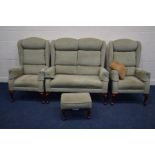 A HSL FOUR PIECE GREEN UPHOLSTERED LOUNGE SUITE comprising a two seater settee, pair of armchairs