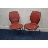 A PAIR OF 1950'S RED LEATHERETTE DINING CHAIRS, with a shaped laminated back and seat, on chrome leg