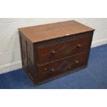 AN EARLY 20TH CENTURY CARVED OAK CHEST OF TWO LONG DRAWERS, with geometric detailing, width 107cm