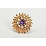 A 9CT GOLD AMETHYST AND PEARL BROOCH, of floral design set with a central circular cut amethyst