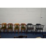 A PAIR OF MODERN EBONISED SMOKERS CHAIRS together with a set of four bentwood style beech