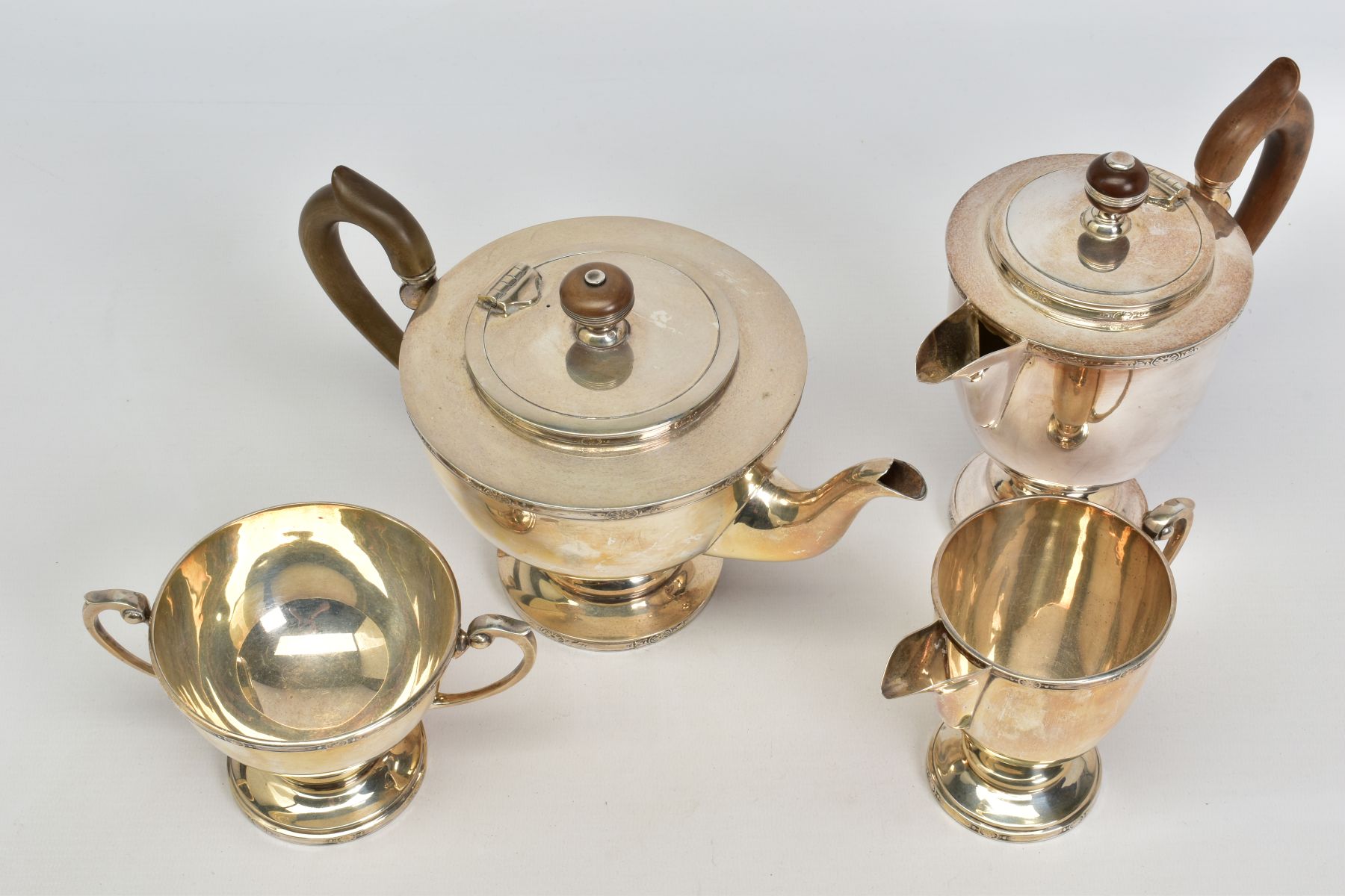 A MATCHED GEORGE V AND ELIZABETH II SILVER FOUR PIECE TEA SERVICE OF CIRCULAR FORM, cast rims with - Image 2 of 6