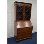 A GEORGE III ROSEWOOD, CROSSBANDED AND STRUNG BUREAU BOOKCASE, the top with double astragal glazed