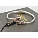A CLOGAU SILVER BANGLE, hinged design with rose gold detail, hallmarked silver, Edinburgh, signed