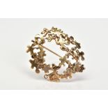 A 9CT GOLD BROOCH, the oval brooch of openwork design, with a 9ct hallmark for Birmingham, length