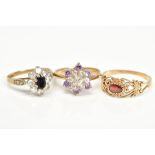 THREE 9CT GOLD GEM SET RINGS, the first designed as a cluster set with an oval cut sapphire and