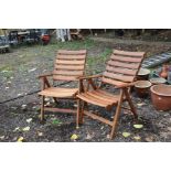 A PAIR OF MODERN HARDWOOD FOLDING GARDEN CHAIRS with slatted seat and back with brass fittings (2)