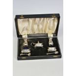 A CASED GEORGE VI SILVER SEVEN PIECE CRUET SET, comprising a pair of pepperettes, a covered