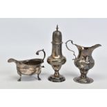 A GEORGE III SILVER CREAM JUG, of baluster form, scroll handle, short pedestal with circular foot,