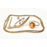 THREE ITEMS OF JEWELLERY, to include a yellow metal ring set with a single claw set, oval cut orange