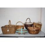 SEVEN BASKETS including an oblong wicker bread basket, a double lidded wicker picnic basket, a small
