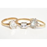 THREE 9CT GOLD GEM SET RINGS, the first a cluster design set with a central oval cut topaz within