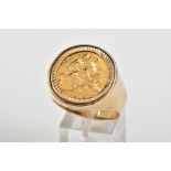 A 9CT GOLD HALF SOVEREIGN RING, set with a 1915 half sovereign within a collet mount to the plain