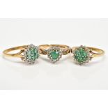 THREE 9CT GOLD EMERALD AND DIAMOND CLUSTER RINGS, to include two circular clusters set with circular