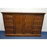 A VICTORIAN MAHOGANY DWARF LINEN PRESS, two banks of five graduated panelled fronted drawers,