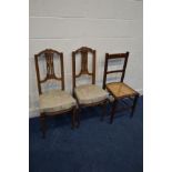 A PAIR OF EDWARDIAN WALNUT HALL CHAIRS together with an Edwardian mahogany bergere seated chair (3)
