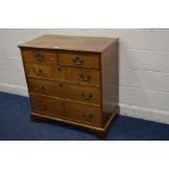 A GEORGE III OAK AND CROSSBANDED CHEST OF TWO OVER THREE LONG GRADUATED DRAWERS, with brass swan