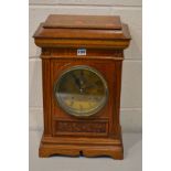 AN EARLY 20TH CENTURY OAK BRACKET CLOCK with a brass dial with carved detail to front face, a