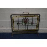 AN EARLY TO MID 20TH CENTURY BRASS AND LEAD GLAZED FIRESCREEN, width 70cm x height 67cm