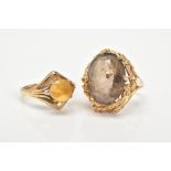 TWO 9CT GOLD GEM SET RINGS, the first ring designed with a claw set oval cut smokey quartz, within a