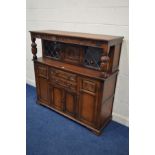 A MODERN OAK COURT CUPBOARD with two drawers, width 141cm x depth 47cm x height 138cm