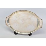 AN ELIZABETH II SILVER OVAL TRAY, with integral handles, plain band to rim, makers Elkington & Co,