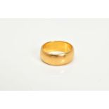 A 22CT GOLD WIDE BAND, the plain polished band with a 22ct hallmark for Birmingham, ring size J,