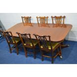 A REPRODUCTION GEORGIAN STYLE MAHOGANY TWIN PEDESTAL DINING TABLE, with rounded ends and one