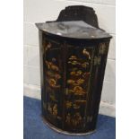 A 19TH CENTURY ORIENTAL EBONISED BOWFRONT TWO DOOR CORNER CABINET, with chinoiserie detail, width